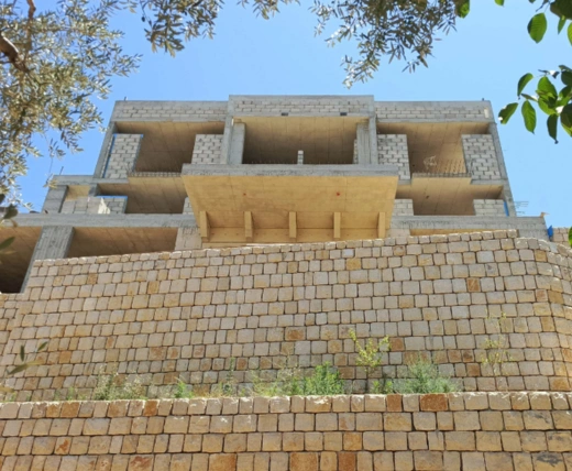Imad AbdelSamad modern white residence Lebanon surrounded by lush greenery — Group Four construction company Chouf