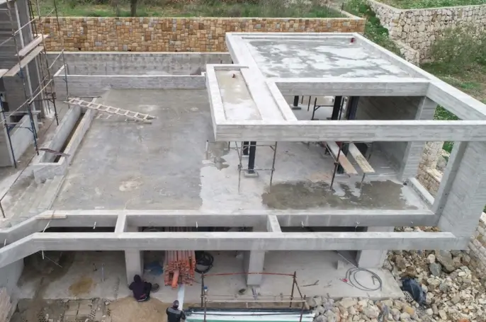Bkassine Club House exterior — stone and black steel façade Jazzine Lebanon — Group Four construction company