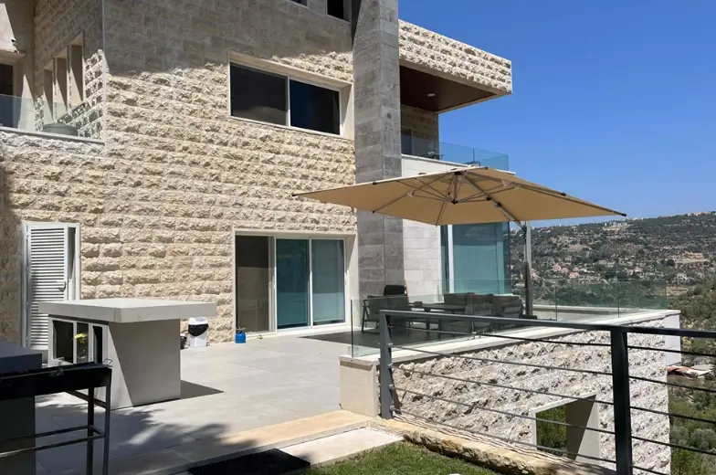 Firas Breish residential building exterior — multi-level hillside design with pool Ain Qani El Chouf Lebanon — Group Four construction company