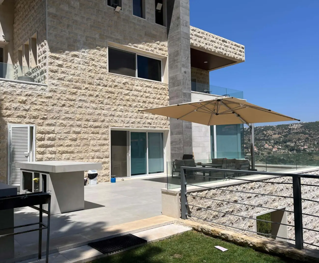 Firas Breish contemporary luxury mountain villa Lebanon panoramic views pool — Group Four construction company Chouf