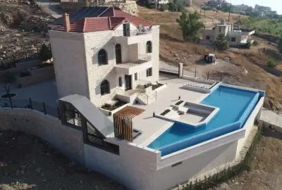Ramzi Halawani Residence exterior stone cladding and terrace construction Badghan Lebanon Group Four
