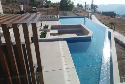 Ramzi Halawani villa swimming pool construction and terrace paving Badghan Aley Group Four