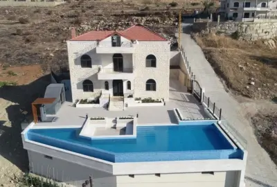 Ramzi Halawani Residence completed exterior stone façade and pool area Badghan Aley Lebanon Group Four