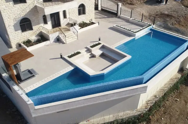Ramzi Halawani residential villa exterior — light-coloured stone façade and terraces Badghan Aley Lebanon — Group Four construction company