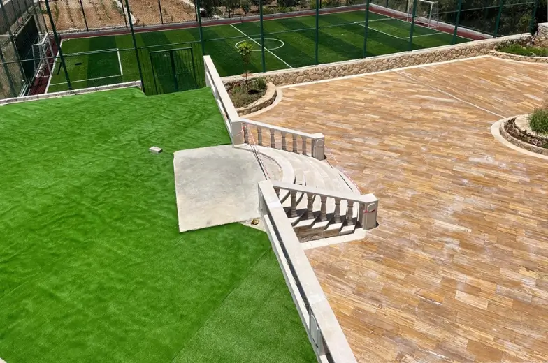 Rawad Zeinedinne residential villa exterior — beige facade arched windows Botmi El Chouf Lebanon — Group Four construction company